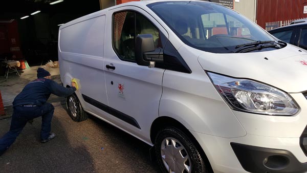 Van side panel accident repair under way