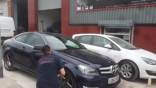 Argyle Autos team member at work on a Mercedes outside the bodyshop